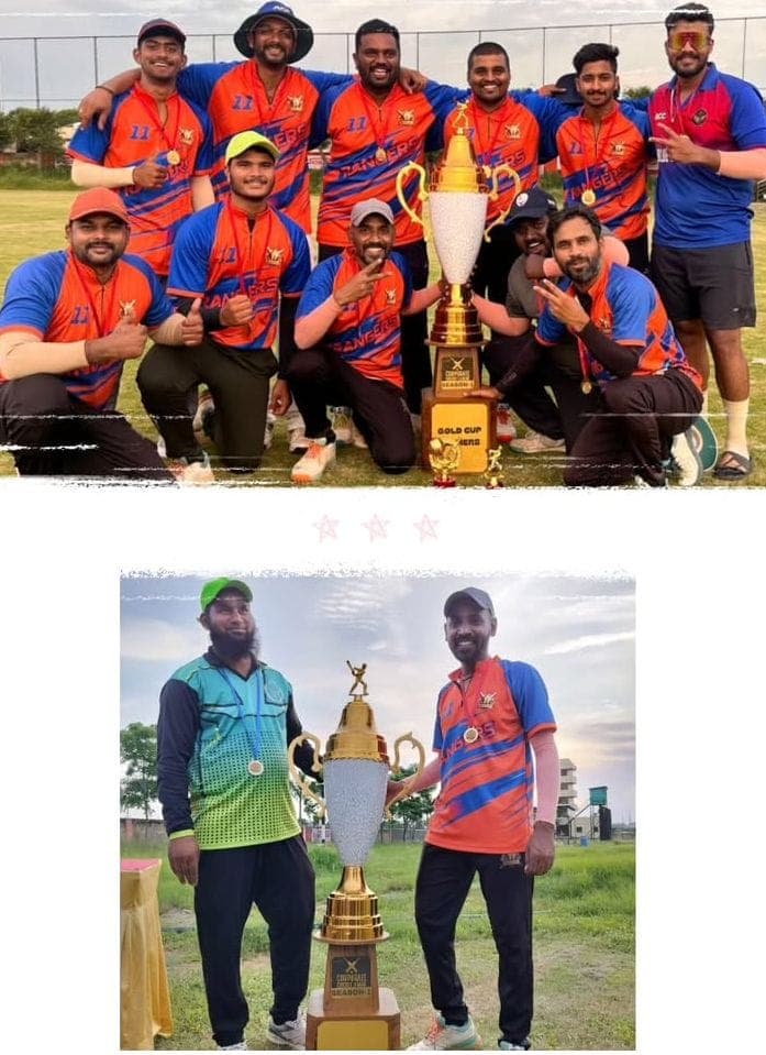 Rangers team celebrating Gold Cup win in orange and blue jerseys